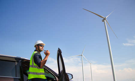 engineer team working in wind turbine farm. Renewable energy with wind generator by alternative energy concept.の写真素材