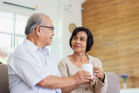 Nursing Home Care concept. elderly couple asian woman are sitting together happily.の写真素材