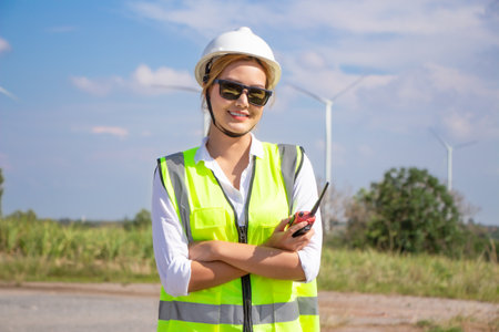 engineer team working in wind turbine farm. Renewable energy with wind generator by alternative energy concept.の写真素材