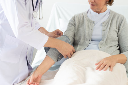 Doctor examining senior woman patient in the hospital. Medical and healthcare concept.の写真素材