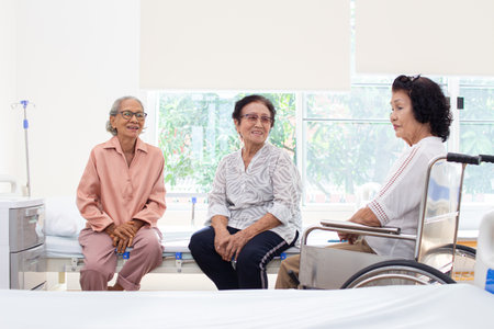Nursing Home Care concept. A group of elderly people in nursing homes meeting with nursing care assistantsの写真素材