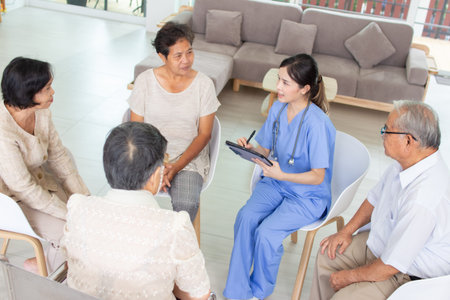 Asian senior patient meeting with doctor and nurse at nursing home or emergency clinic.の写真素材