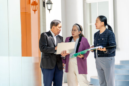 Group of business people discussing a business plan in the office. Asian people