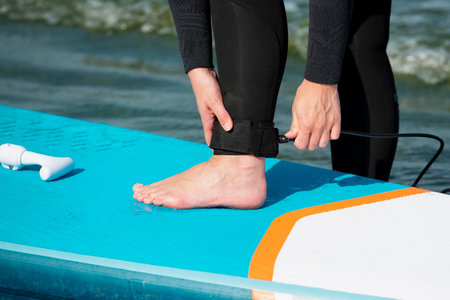 Close-up of a woman's foot in a wetsuit.の写真素材