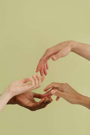 Group of people gesturing with their hands on a green background.