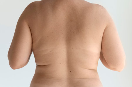 Fat man with overweight on white background, closeup.の写真素材