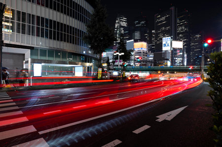 the light trails on the modern building backgroundの写真素材