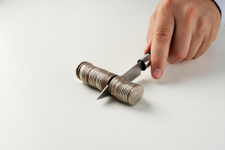 Man's hand holding a metal knife on a white background. Close-up.