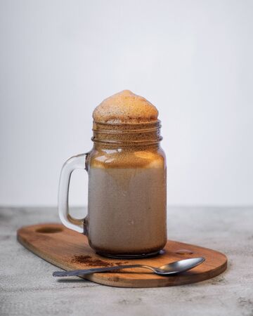 Dalgona coffee on white backgroundの写真素材