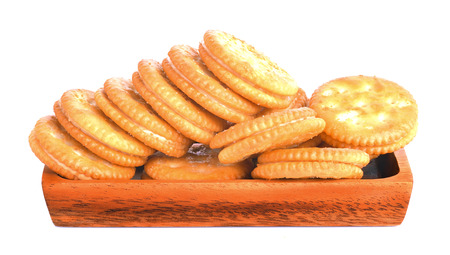 biscuits on wood plate white backgroundの写真素材