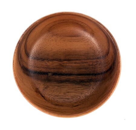 Closeup shot from top view of empty wood bowl isolated on white background.の写真素材