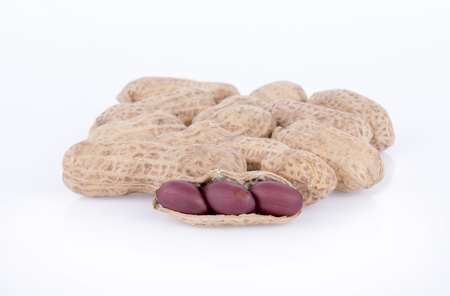 close up of roasted peanuts isolated on whiteの写真素材