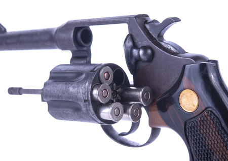closeup shot of .38 revolver handgun's bullets in the storage cylinderの写真素材