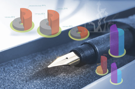 closeup pen and nib with graph,economy idea,business idea , defocus