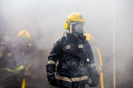 Firemen in a fire-fighting training exercise
