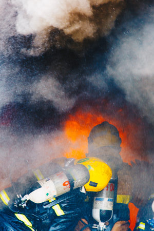 Firefighters fighting fire, Firefighters trainingのeditorial素材