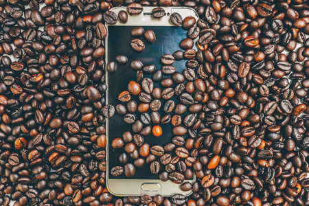 coffee beans with smartphoneの写真素材