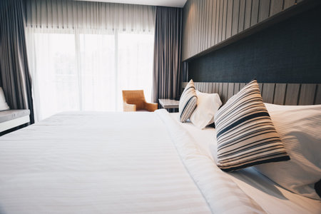 bedding sheets and pillow in hotel room.の写真素材