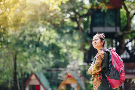 Traveler backpacker Asian woman with nature background , Traveler conceptの写真素材