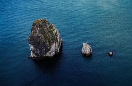 Protruding mountain of water, sea, oceanの写真素材