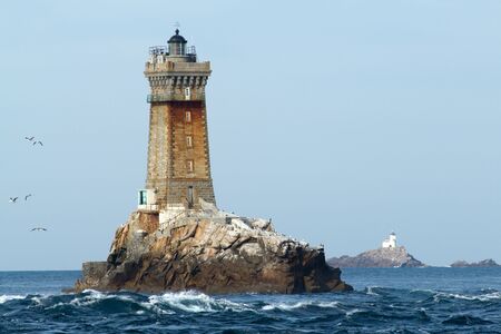Ancient lighthouse near the sea of the wavesの写真素材