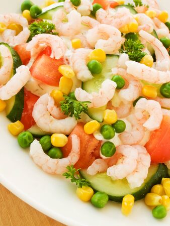 salad with seafood shrimp vegetables on a plateの写真素材