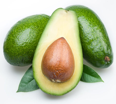 Avocado in cut half pulp bone white background .