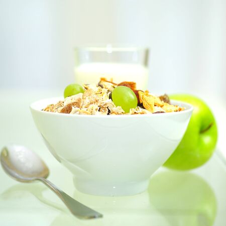 breakfast set, milk, flakes and apple on white background .の写真素材