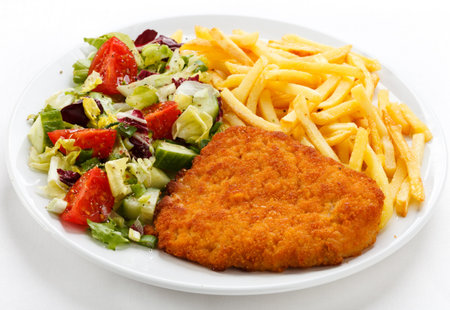 Chop meat fries vegetables salad white background .
