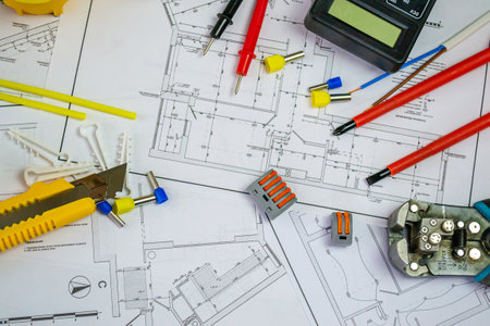 Flat lay composition with electrician's tools on house plan. Space for textの写真素材