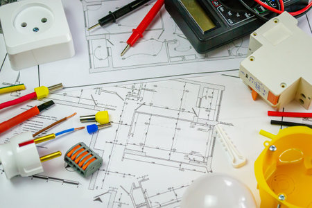 Flat lay composition with electrician's tools on house plan. Space for textの写真素材