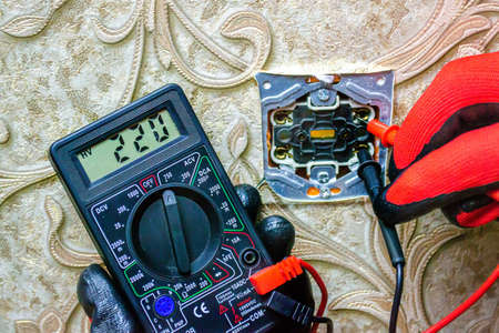 Repair of the socket, socket. Tools, voltage measuring devices. selective focus.の写真素材