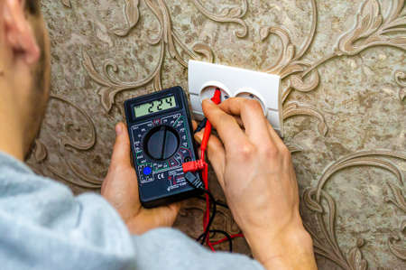 Repair of the socket, socket. Tools, voltage measuring devices. selective focus.の写真素材
