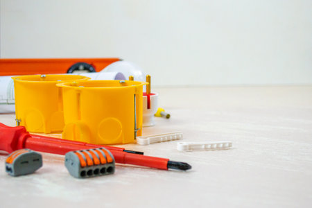 Flat lay composition with electrician's tools on wooden backgroundの写真素材