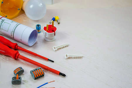 Flat lay composition with electrician's tools on wooden backgroundの写真素材