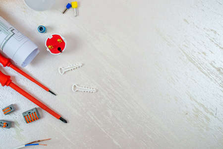 Flat lay composition with electrician's tools on wooden backgroundの写真素材