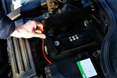 Mechanic repairs car in a car repair stationの写真素材