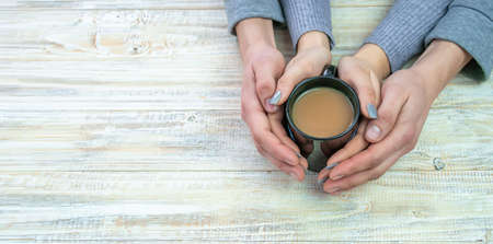 Concept of male and female hands, love and coffeeの写真素材
