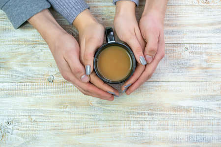 Concept of male and female hands, love and coffeeの写真素材