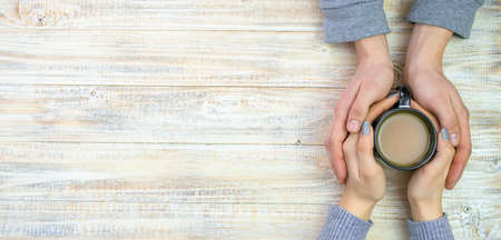 Concept of male and female hands, love and coffeeの写真素材