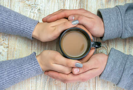 Concept of male and female hands, love and coffeeの写真素材