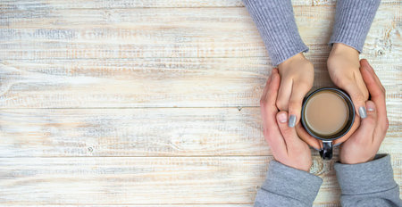 Concept of male and female hands, love and coffeeの写真素材