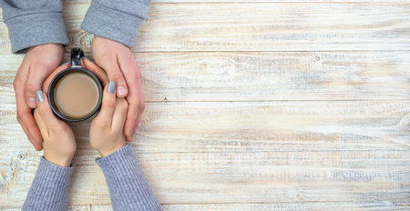 Concept of male and female hands, love and coffeeの写真素材