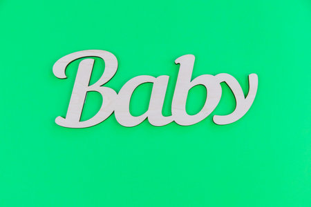 lettering baby on a green background