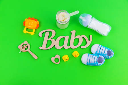 various accessories for babies. green background. selective focus.の写真素材