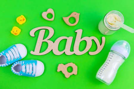 various accessories for babies. green background. selective focus.の写真素材