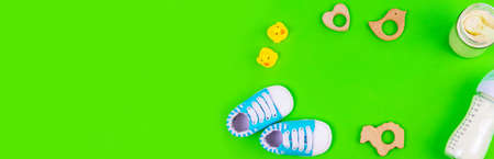 various accessories for babies. green background. selective focus.の写真素材
