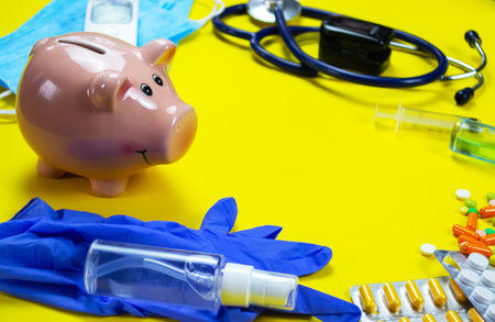 medicines, pills, mask, virus on a yellow background covidの写真素材