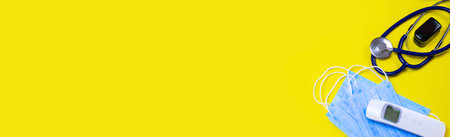 medicines, pills, mask, virus on a yellow background covidの写真素材