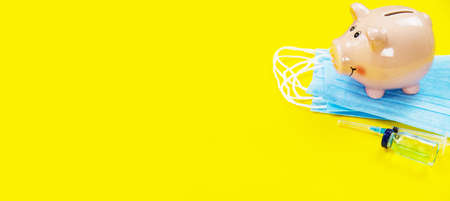 medical supplies on a yellow background, pills water treatment mask virus. Selective focusの写真素材